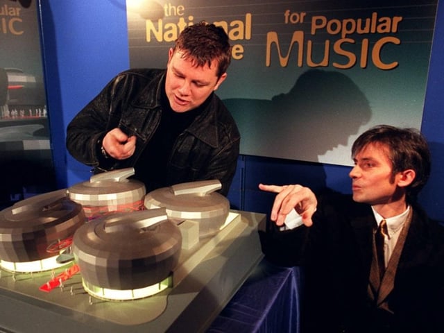 Nick Banks and Russell Senior of Pulp look at a scale model of the centre in 1996.