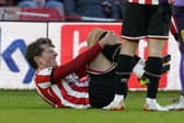 Sander Berge of Sheffield United was in some pain after a late challenge against Coventry City: Andrew Yates / Sportimage
