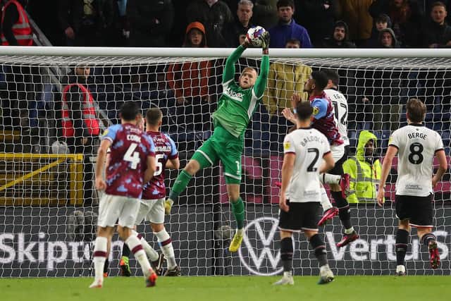 Adam Davies makes a save after coming on for Sheffield United at Burnley: Simon Bellis / Sportimage