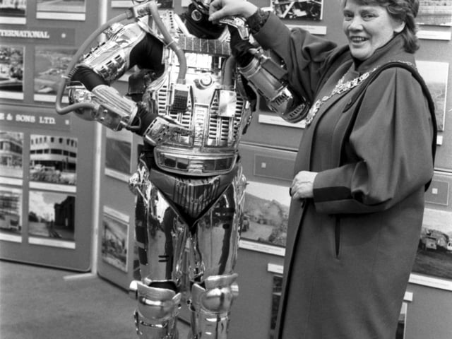 The Miller Group sent along Adam Robot to present a cheque for the Edinburgh Science festival to Lord Provost Eleanor McLaughlin in January 1990.