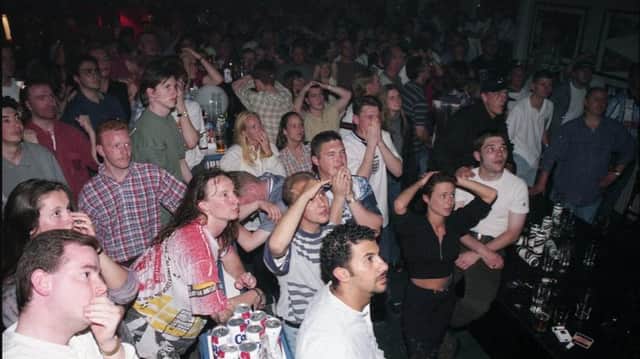 It's so tense for these fans as they watch England's Euro 96 semi-final with Germany. Are you pictured?