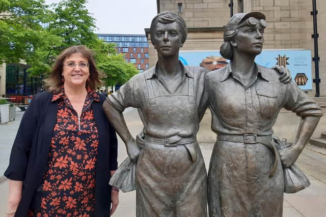 Sheffield heritage champion Coun Janet Ridler standing next to the city's famous Women of Steel statue outside Sheffield City Hall
