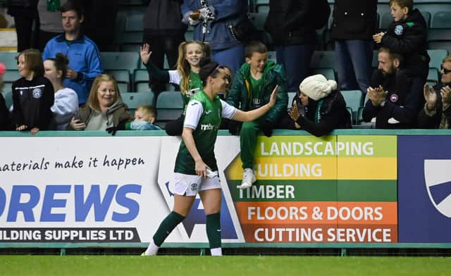 Hibs' Amy Gallacher interacts with fans at full time.