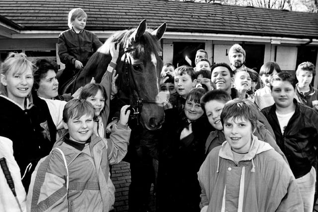 Pupils of Norfolk Comprehensive School enjoy a visit by Mounted Police in February 1989