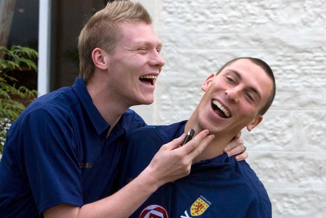 Former Hibs team-mates Garry O’Connor (left) and Scott Brown share a joke as they meet up with the Scotland squad