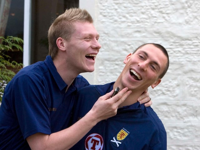 Former Hibs team-mates Garry O’Connor (left) and Scott Brown share a joke as they meet up with the Scotland squad
