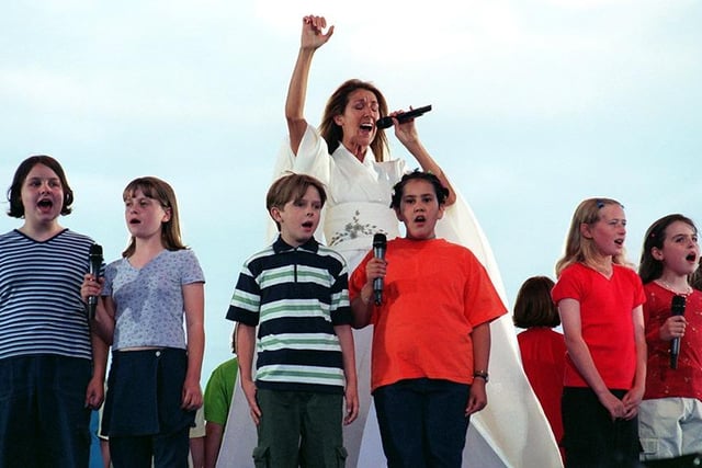 Celine Dion performing at Don Valley Stadium with the Sheffield Childrens  Choir in July 1999