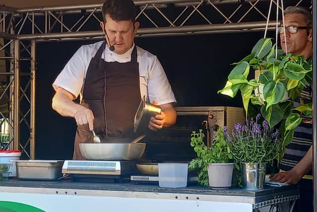 Chef Chris Hanson, from Blend restaurant, cooking on the Demo stage at Sheffield Food Festival in the city centre. This weekend's event has a royal theme to celebrate the Queen's Platinum Jubilee bank holiday weekend