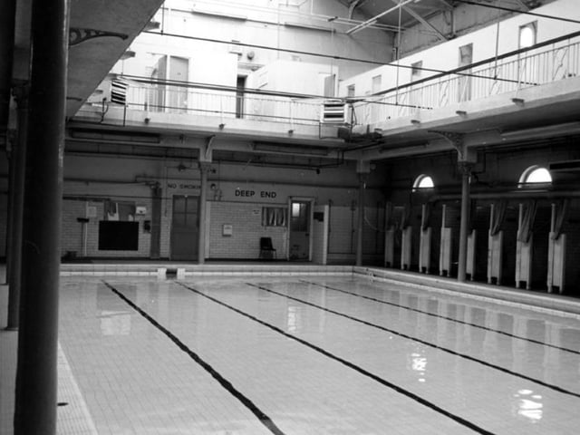 Deep end and changing cubicles at Attercliffe Road Swimming Baths, on Attercliffe Road, Sheffield, in February 1985