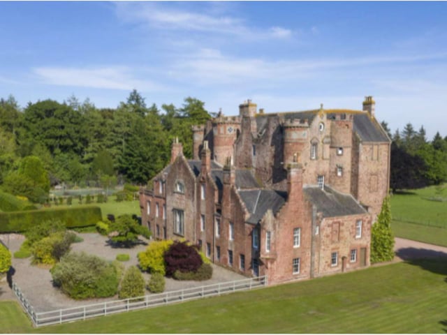 Surrounded by glorious gardens and parkland, this exquisite fortified castle is built from a distinctive red sandstone and displays crowstepped gables, castellated turrets and astragal windows.