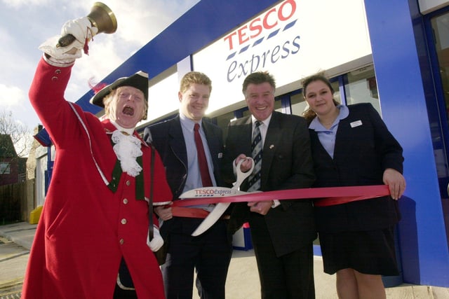 Emlyn Hughes performs the opening ceremony at the new Tesco Express store at Chapeltown, under the careful watch of Town Cryer cyril Richardson helped by staff Phillip Wordsworth and Rachel Hough in 2002