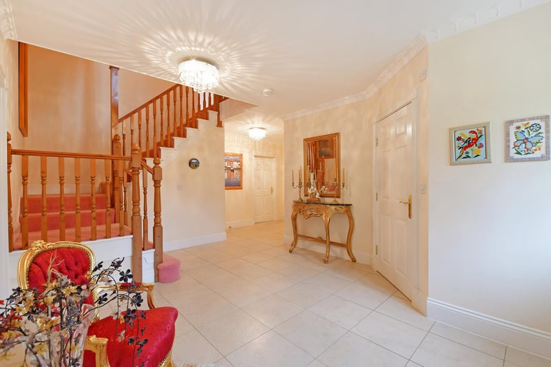A sizeable entrance hall with a front facing double glazed leaded window, coved ceiling and tiled flooring with under floor heating. Timber doors open to the snug, breakfast kitchen, WC and storage cupboard. Double timber doors also open to the lounge and formal dining room.