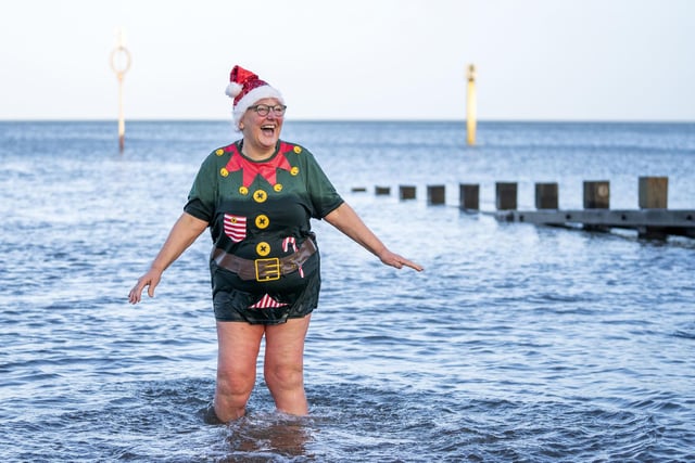 Julie Gannucci from Portobello, takes a dip in the Firth of Forth at Portobello Beach in Edinburgh on New Year's Day. Picture date: Saturday January 1, 2022. PA Photo. Photo credit should read: Jane Barlow/PA Wire