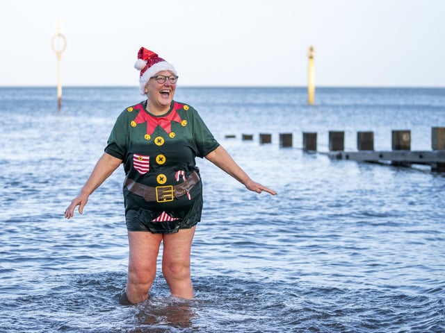 Julie Gannucci from Portobello, takes a dip in the Firth of Forth at Portobello Beach in Edinburgh on New Year's Day. Picture date: Saturday January 1, 2022. PA Photo. Photo credit should read: Jane Barlow/PA Wire