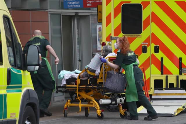 A patient is brought into the Royal London Hospital, in London