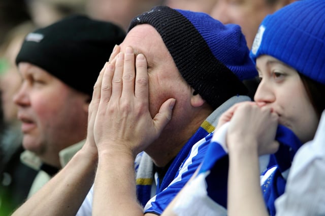 Heartbroken Wednesday fans can't bear to look as their side is relegated to League One in May 2010.