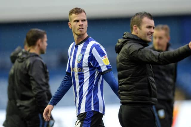 Sheffield Wednesday's Dutch defender Joost van Aken has joined Zulte-Waragem.