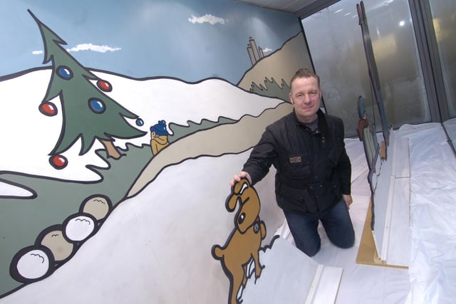 Artist Pete McKee with a piece of 3-D work that he created on display at the Audi garage in Meadowhead, Sheffield in December 2009