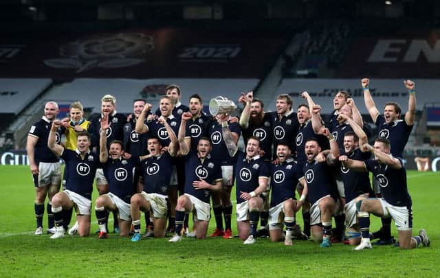 Scotland celebrate with the Calcutta Cup after the Guinness Six Nations match at Twickenham Stadium, London.