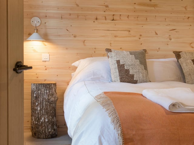Pipit is one of the treehouses furnished with a Scandinavian look. The picture shows a peep inside its bedroom. Both Louisa and Simon designed and furnished all the treehouses themselves. With a background in working for safari travel companies in Africa, the 31-year-old from Inverness has an eye for what holidaymakers like.