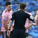 Sheffield United's John Lundstram protests his innocence after being sent off by referee Peter Bankes during his side's 1-1 draw at Brighton on Sunday. (Photo by MIKE HEWITT/POOL/AFP via Getty Images)