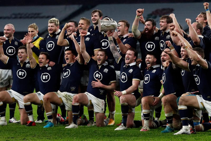 Scotland players celebrate with the Calcutta Cup after beating England 6-11 in the Six Nations rugby union match at Twickenham Stadium in south west London today. (Photo by Adrian Dennis/AFP via Getty Images)