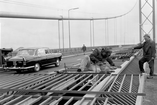 A workman welding on the Forth Road Bridge - last-minute work before it opened in September 1964.