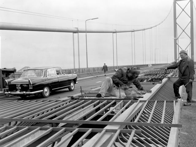 A workman welding on the Forth Road Bridge - last-minute work before it opened in September 1964.