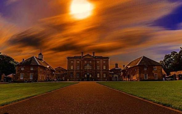 The sun setting over Cusworth Hall from @si_s_place