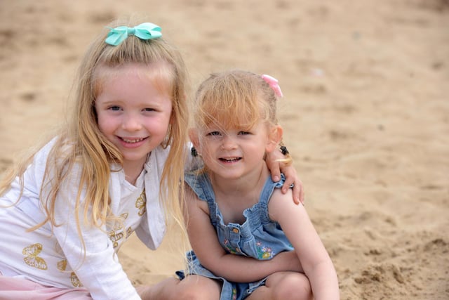 Sisters Katie-Rose Whittle, five and Isabella, three enjoying playing in the sand on Seaton Carew beach.
