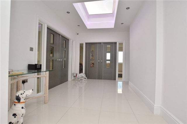 The property is accessed via a stylish entrance lobby, which includes useful cloaks storage and feature lighting helping to make it feel bright and spacious.
