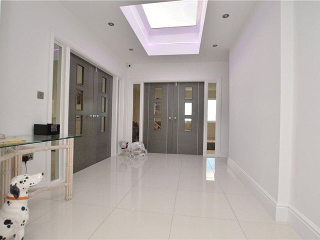 The property is accessed via a stylish entrance lobby, which includes useful cloaks storage and feature lighting helping to make it feel bright and spacious.