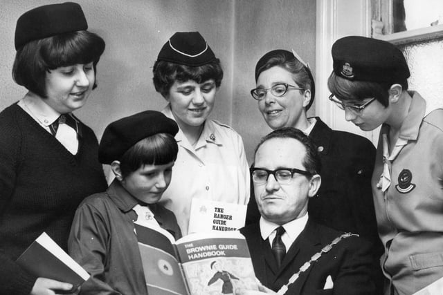 This photo shows new books being presented to Guides and Rangers in 1968. Were you in the picture?
