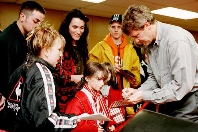 Then player Steve Bruce signs autographs at United's Open Day in 1998