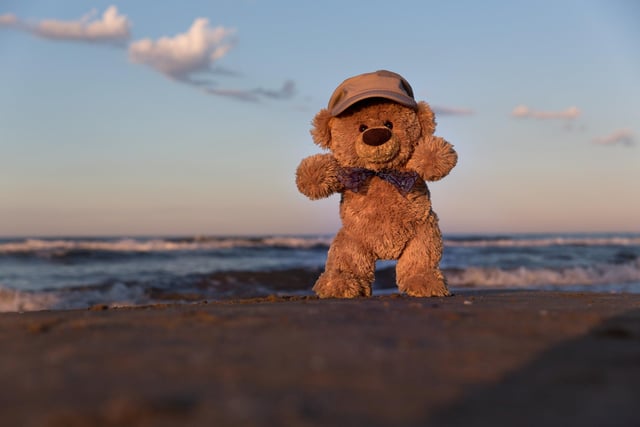 John James the teddy bear at Sunset on the beach in Barcelona, Spain. 
These adorable teddy bears could be the world's most well-travelled cuddly toys - as their photographer owner has chronicled their adventures in 27 different countries. Christian Kneidinger, 57, has been travelling with his teddy bears, named John and Bob since 2014 - and his taken them to some of the world's most famous landmarks. The teddy bears have dressed up in traditional Emirati clothing to visit the Sultan's Palace in Oman, and have braved the cold on a glacier on Lofoten Island in Norway.