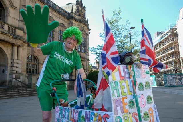 John Burkhill, Sheffield's own green-wigged hero and perhaps better known as the 'man with the pram' has raised over £1,000,000 for Macmillan Cancer Support