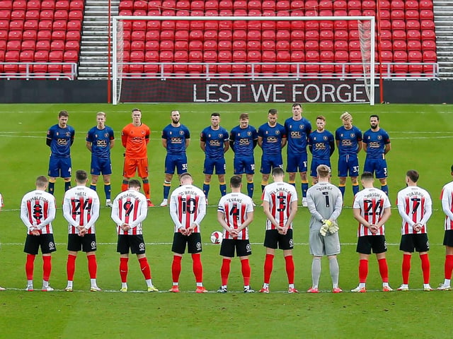 Both teams observe a minutes silence for Remembrance Day.