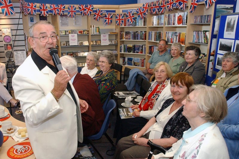 A singalong for the anniversary of VE Day in 2005. Ken Peters is leading the way but were you pictured with him in Boldon Lane Library?
