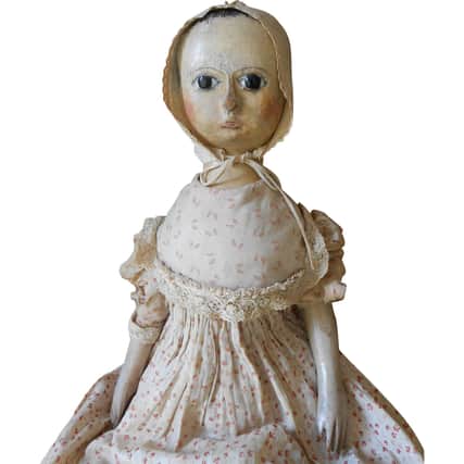 Antique wooden doll.