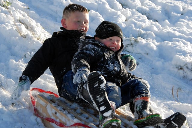 Mansfield youngsters 9-year-old Jake Sims and his brother 3-year-old Kieran are pictured enjoying the snow at Mansfield's Fisher Lane Park in December 2010