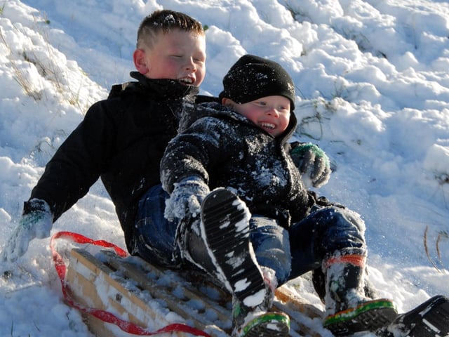 Mansfield youngsters 9-year-old Jake Sims and his brother 3-year-old Kieran are pictured enjoying the snow at Mansfield's Fisher Lane Park in December 2010