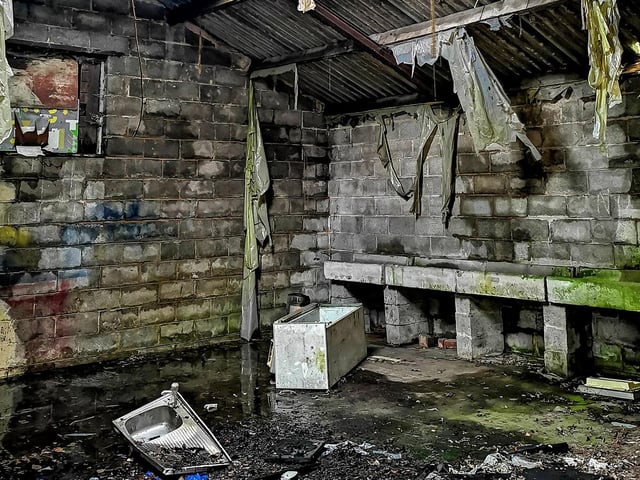 The building is a former dairy farm.