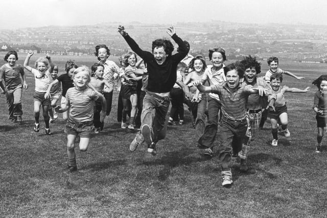 Children having fun in Parson Cross Park during the school summer holidays in August 1975