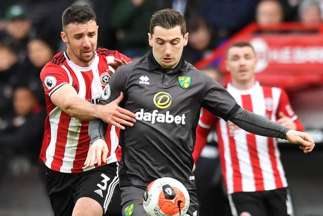 Sheffield United's Enda Stevens (left) and Norwich City's Kenny McLean battle for the ball: Anthony Devlin/PA Wire