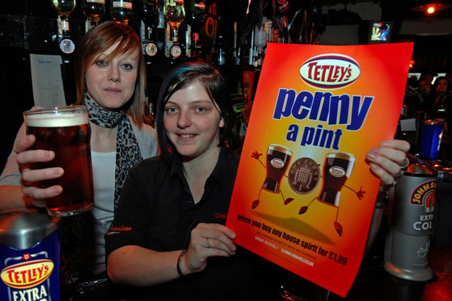 Bar staff Hayley Jones and Right supervisor Kirsty Chadwick selling pints for a penny at Chennells Pub in Barnsley's town centre in 2009