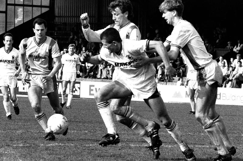 Steve Charles, Mark Kearney and Simon Coleman in action in the thrilling FA Cup tie with Wolves.