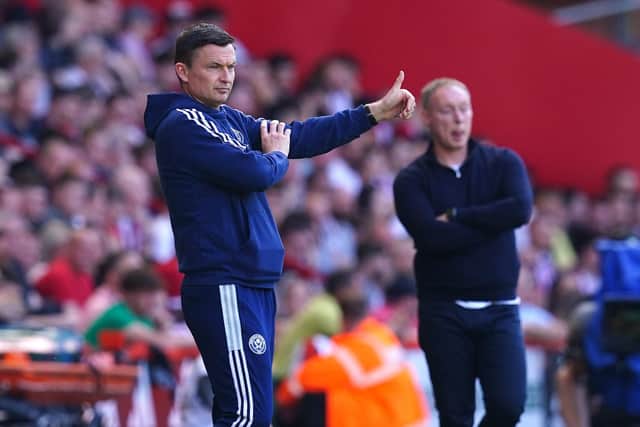 Sheffield United manager Paul Heckingbottom (left) encourages their players as Nottingham Forest manager Steve Cooper looks on.