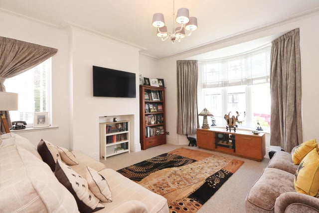 The lounge features a bay window and is typical of the property's spacious accommodation with modern fittings throughout.