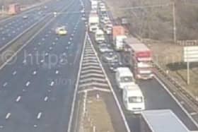 A man was killed near South Yorkshire in a crash which shut the M1 for several hours, say police. Picture shows police closing the road yesterday