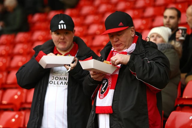 United supporters enjoy some pre-match food ahead of the home game with Bradford City in December 2015.